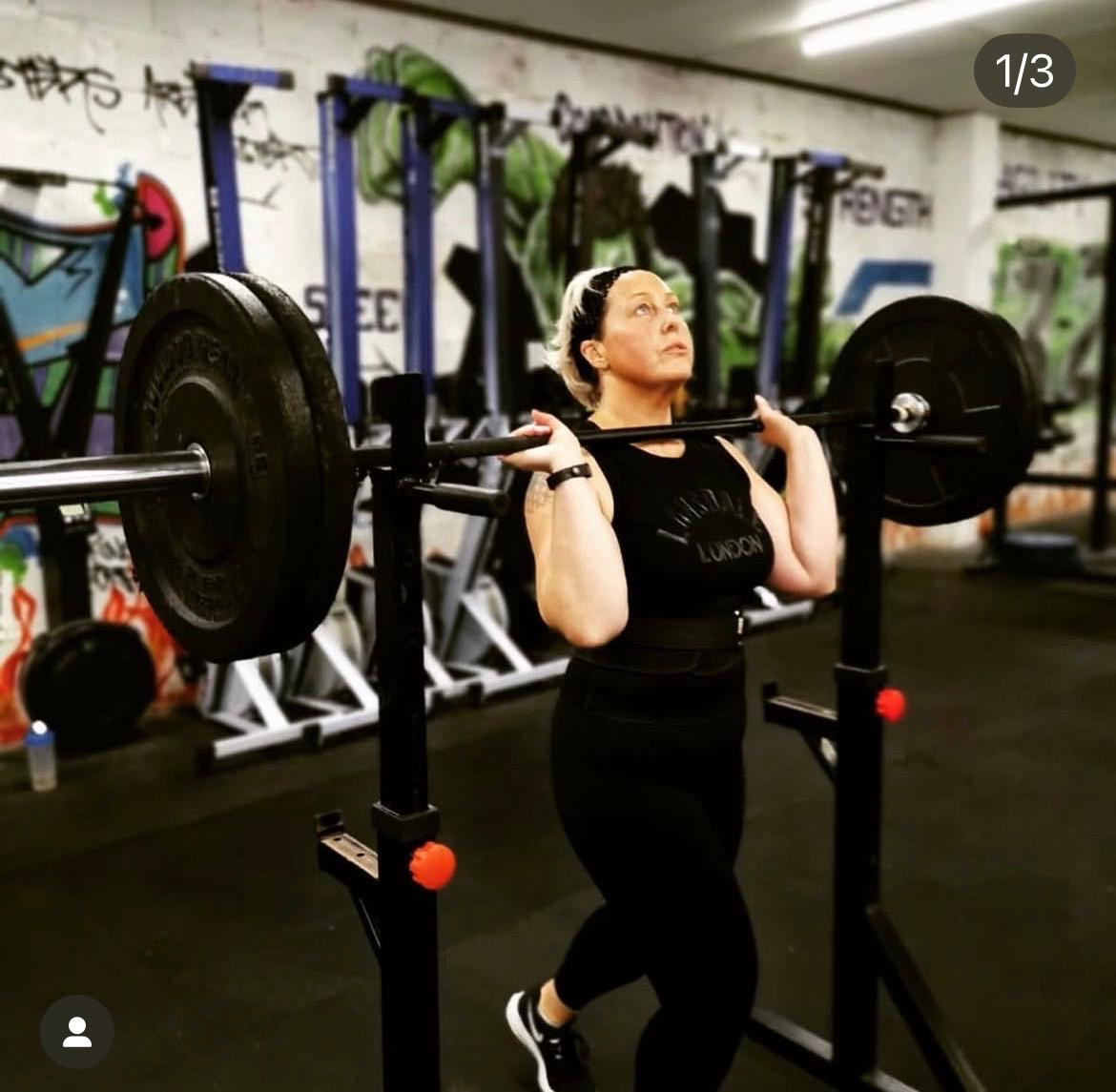 Victoria lifting weights in the gym