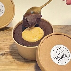 Dipping a spoon into a cholate and orange brownie bomb
