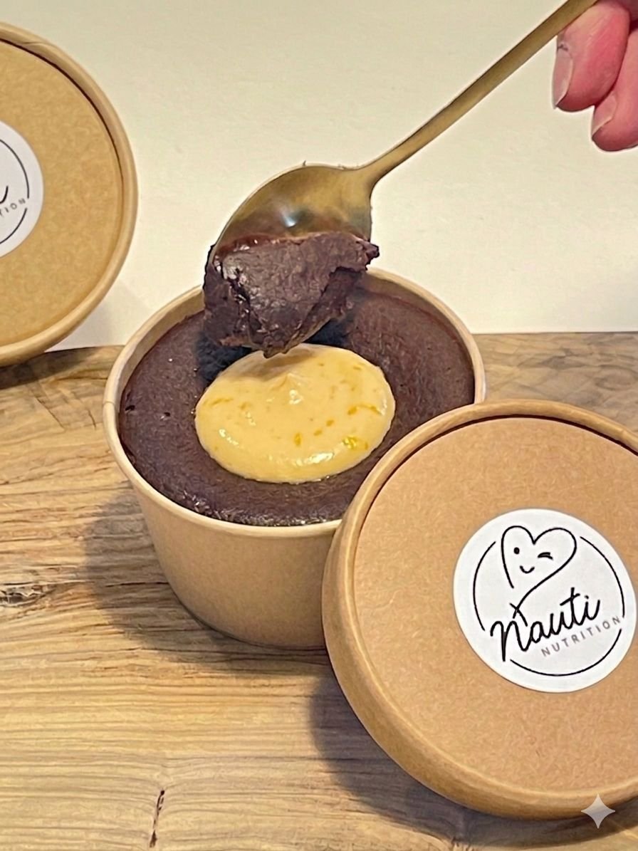 Dipping a spoon into a cholate and orange brownie bomb