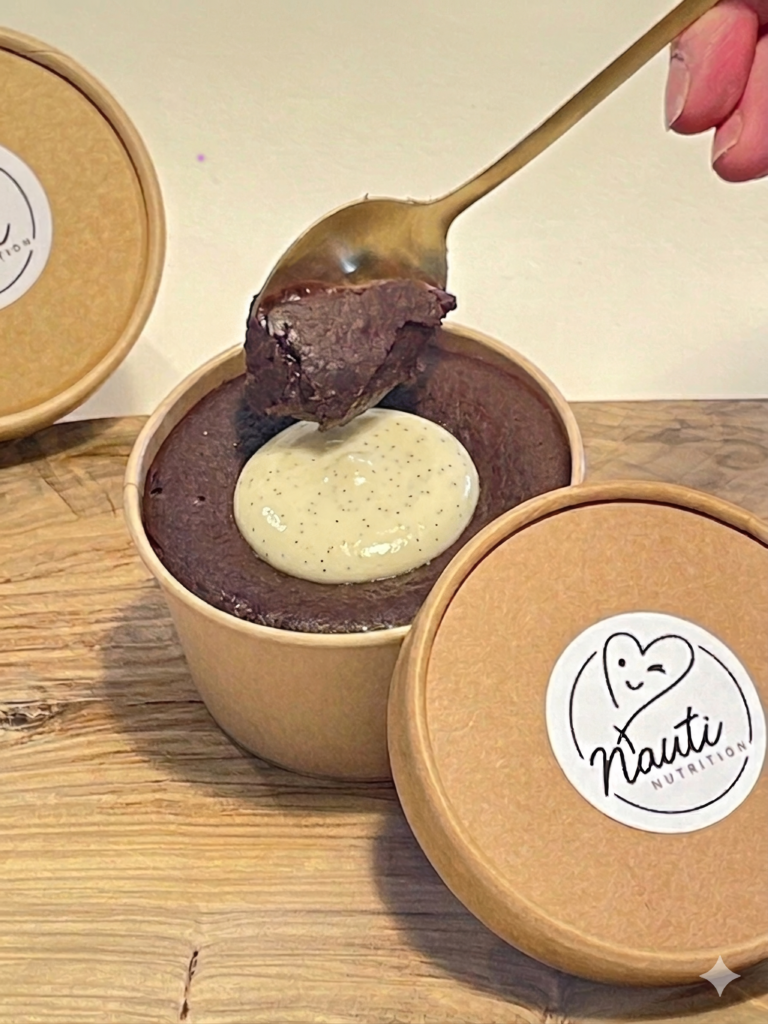 Dipping a spoon into a cholate and vanilla brownie bomb